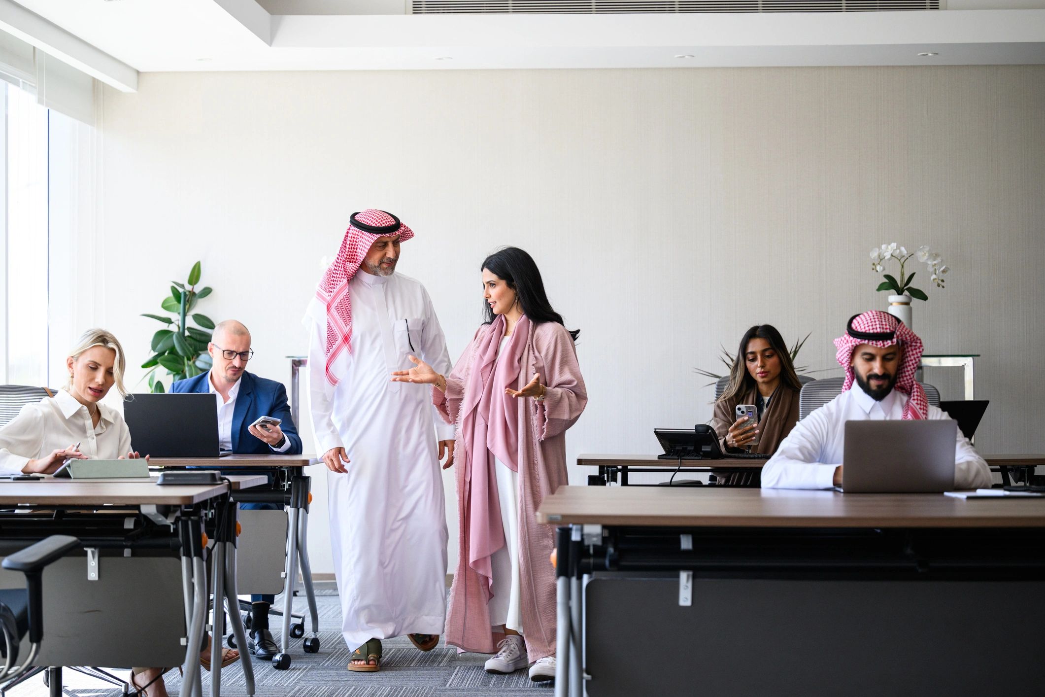 Corporate team collaborating in a modern office