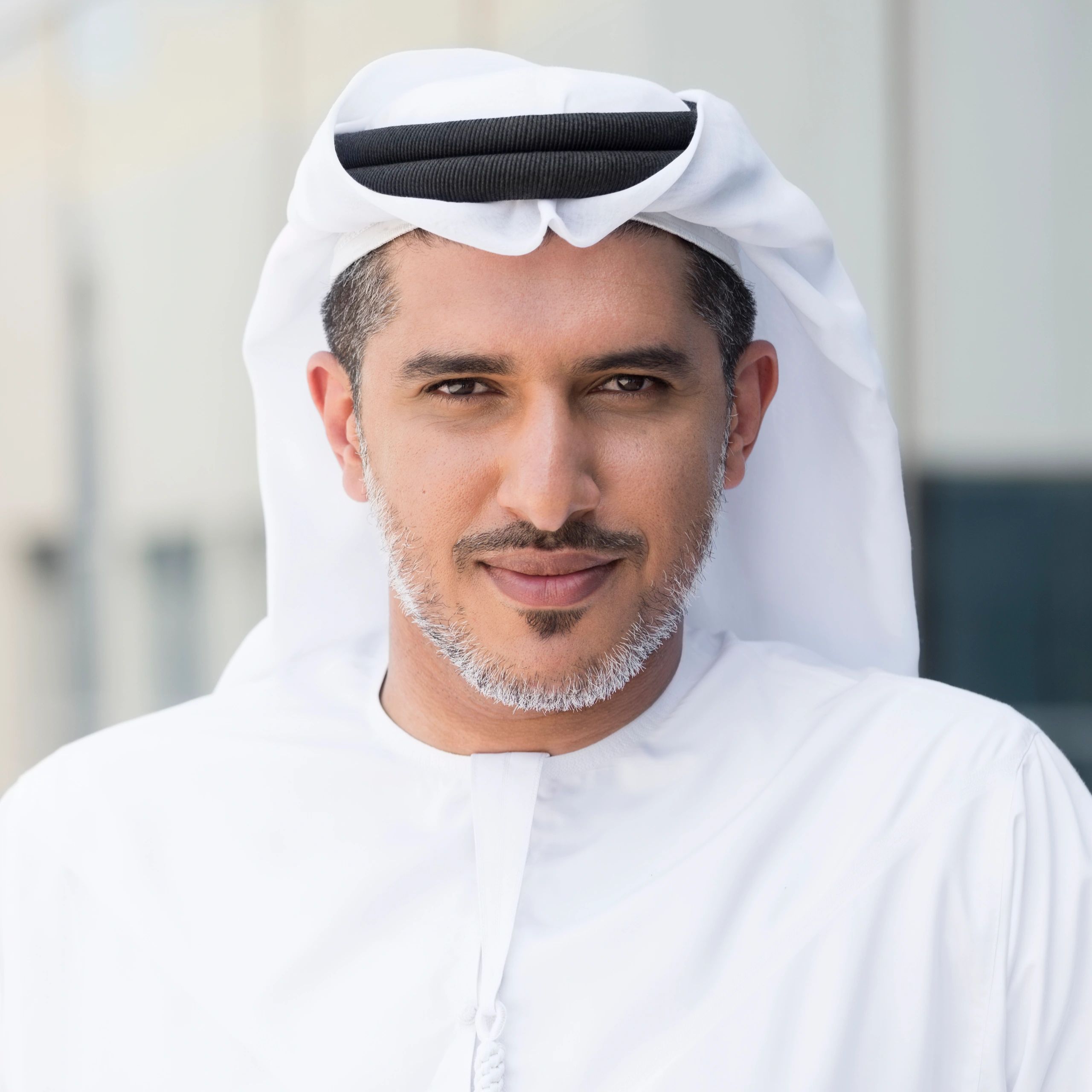 Portrait of Arab businessman outside office building